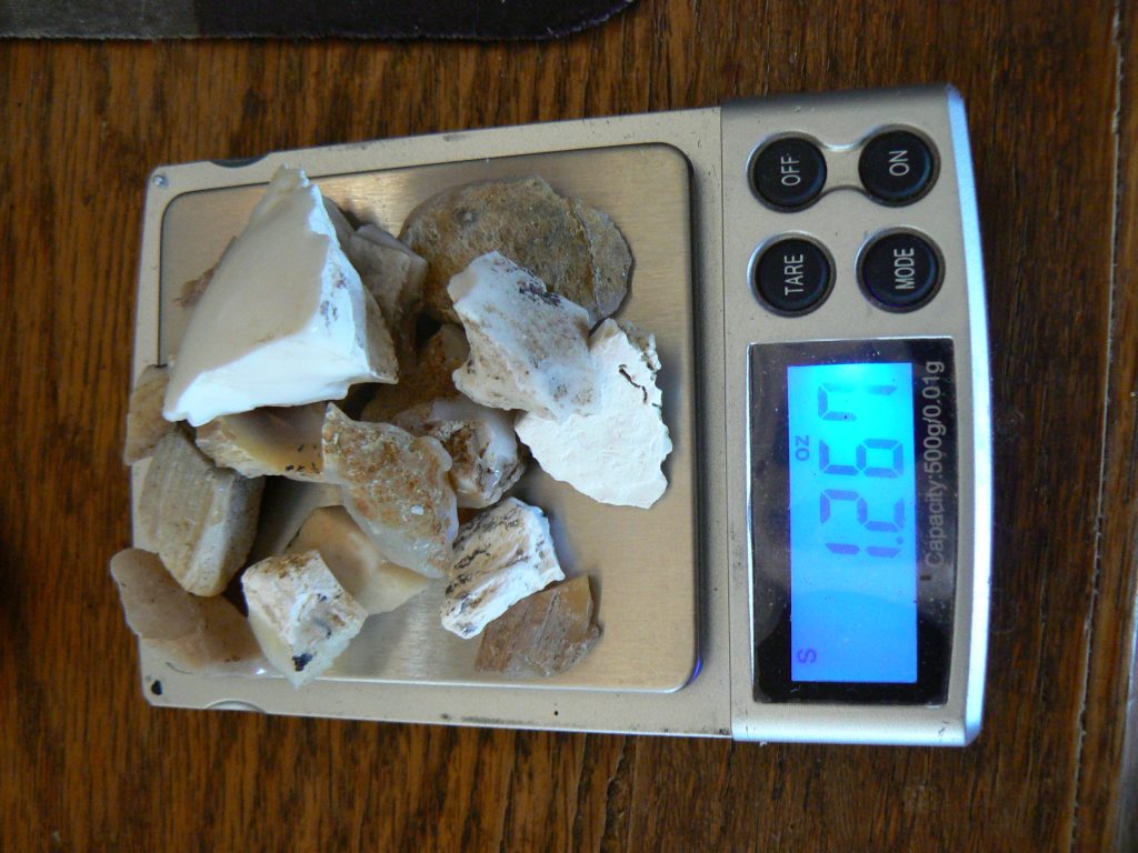 Dry Virgin Valley Precious Opal rough parcel on gem scale